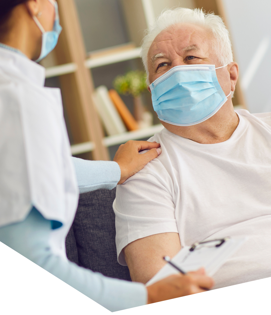 GP reviewing an older patient's ongoing care during a chronic disease management appointment